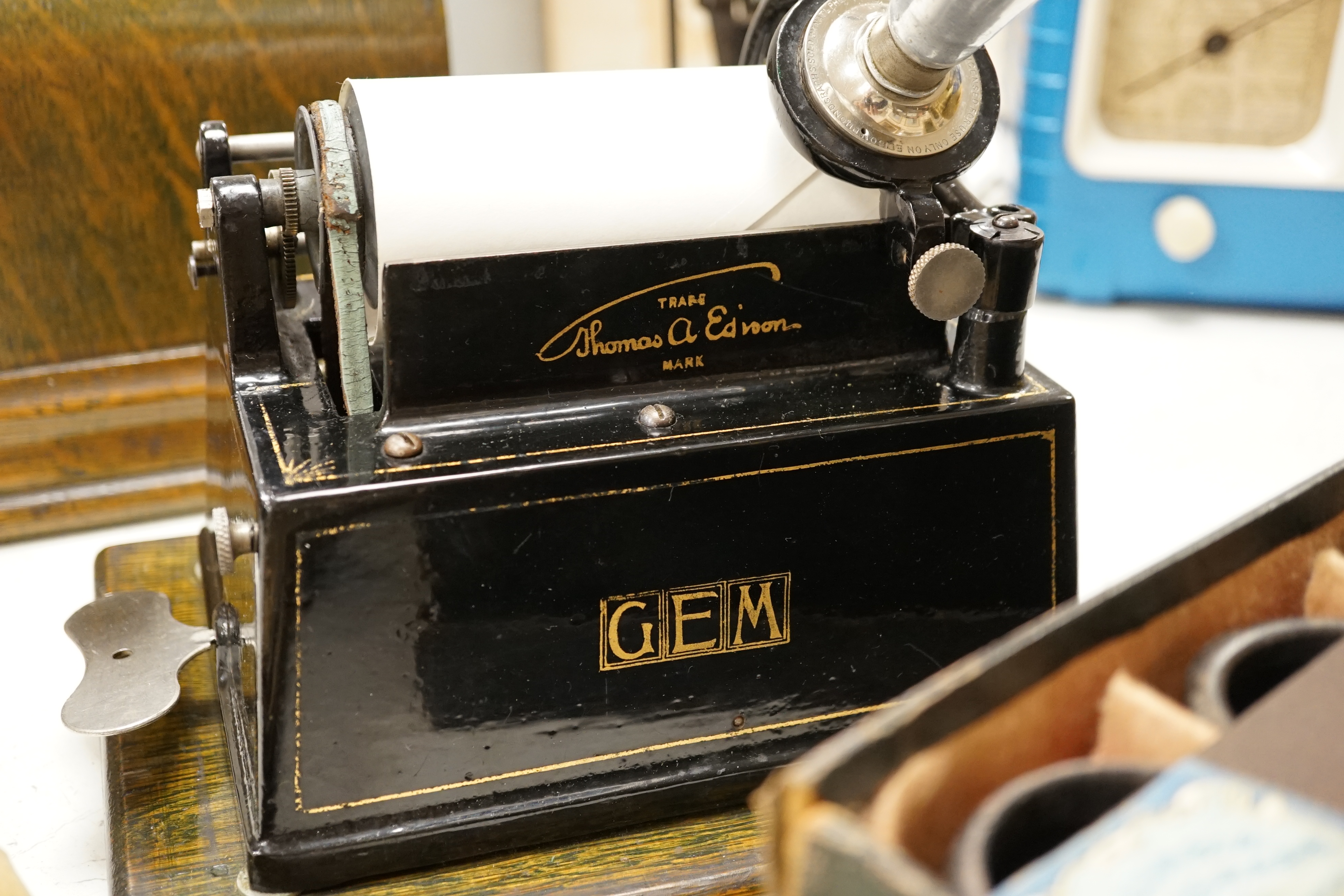 An oak cased Edison Little Gem phonograph with zinc horn and an original card box containing nineteen cylinders